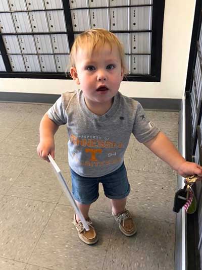 child at post office excited about his new book